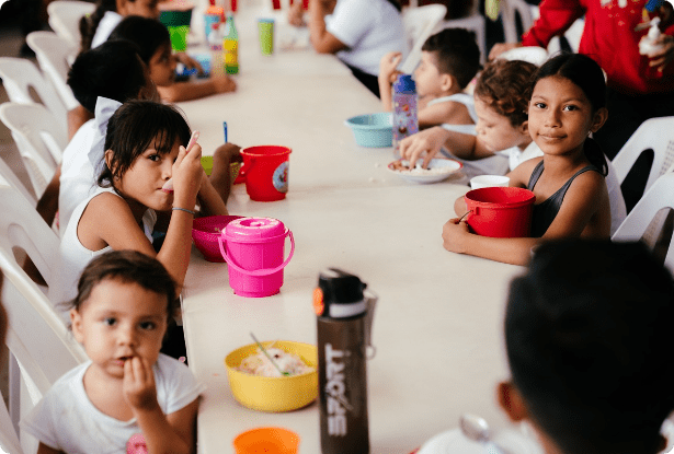 Children sharing a nutritious meal through ORPHANetwork’s health and nutrition program