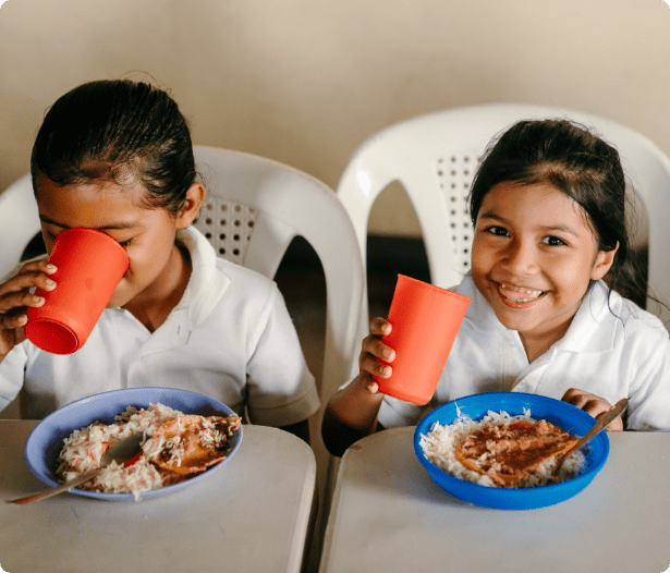 Children enjoying a nutritious meal through ORPHANetwork’s child nutrition program